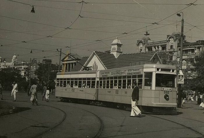 A old black and white picture of electric tram in calcutta, India.